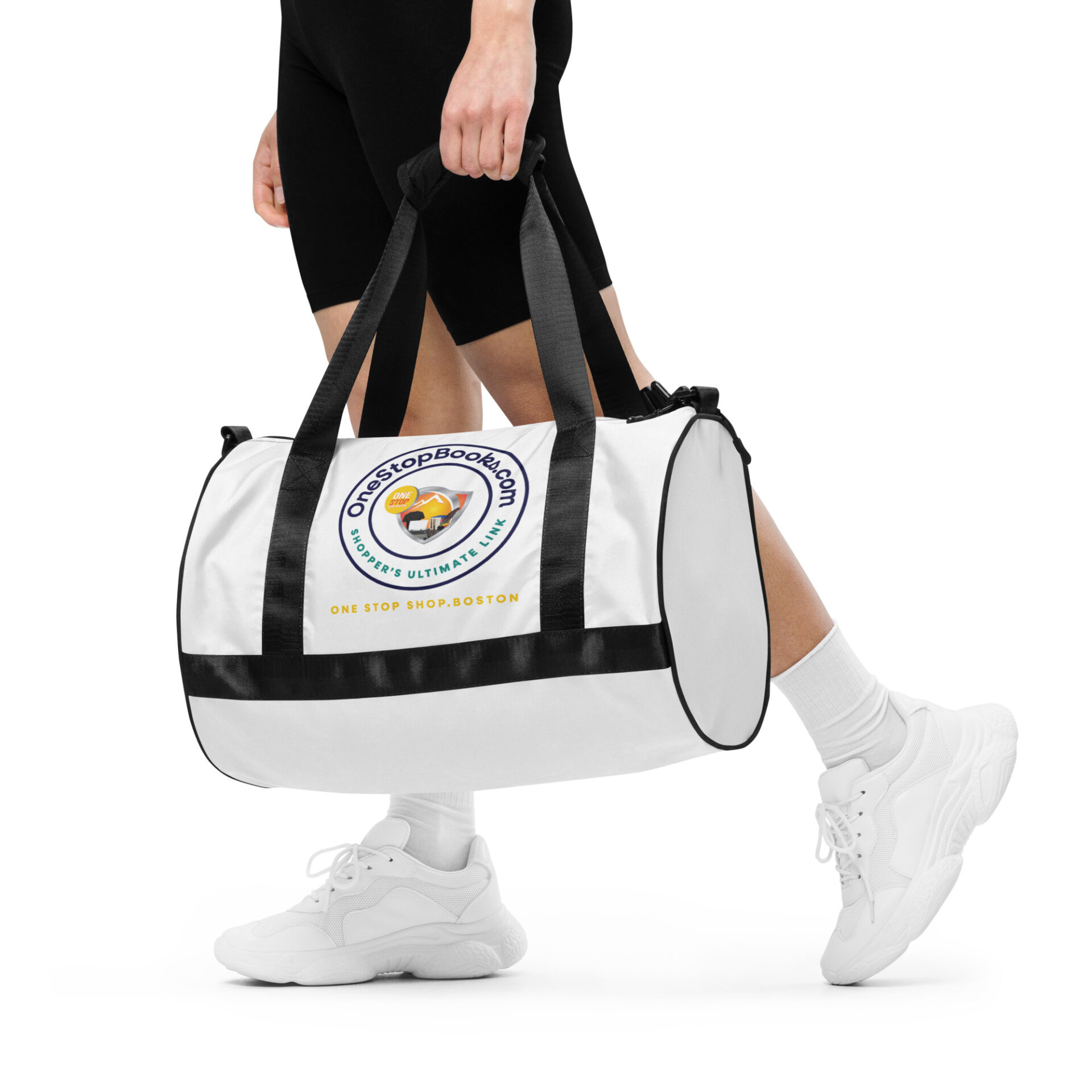 Person holding a white duffel bag.
