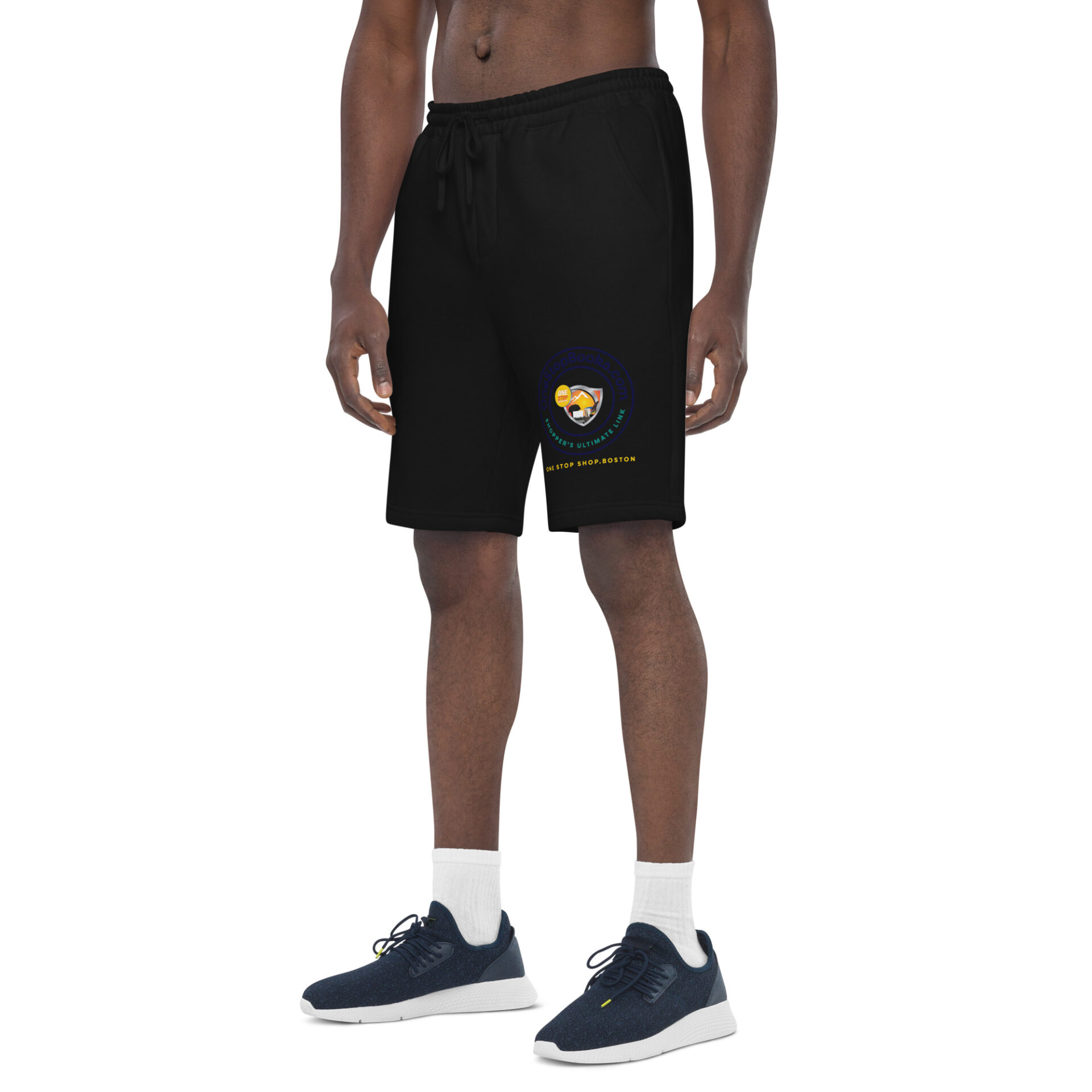 Man wearing black shorts with logo.