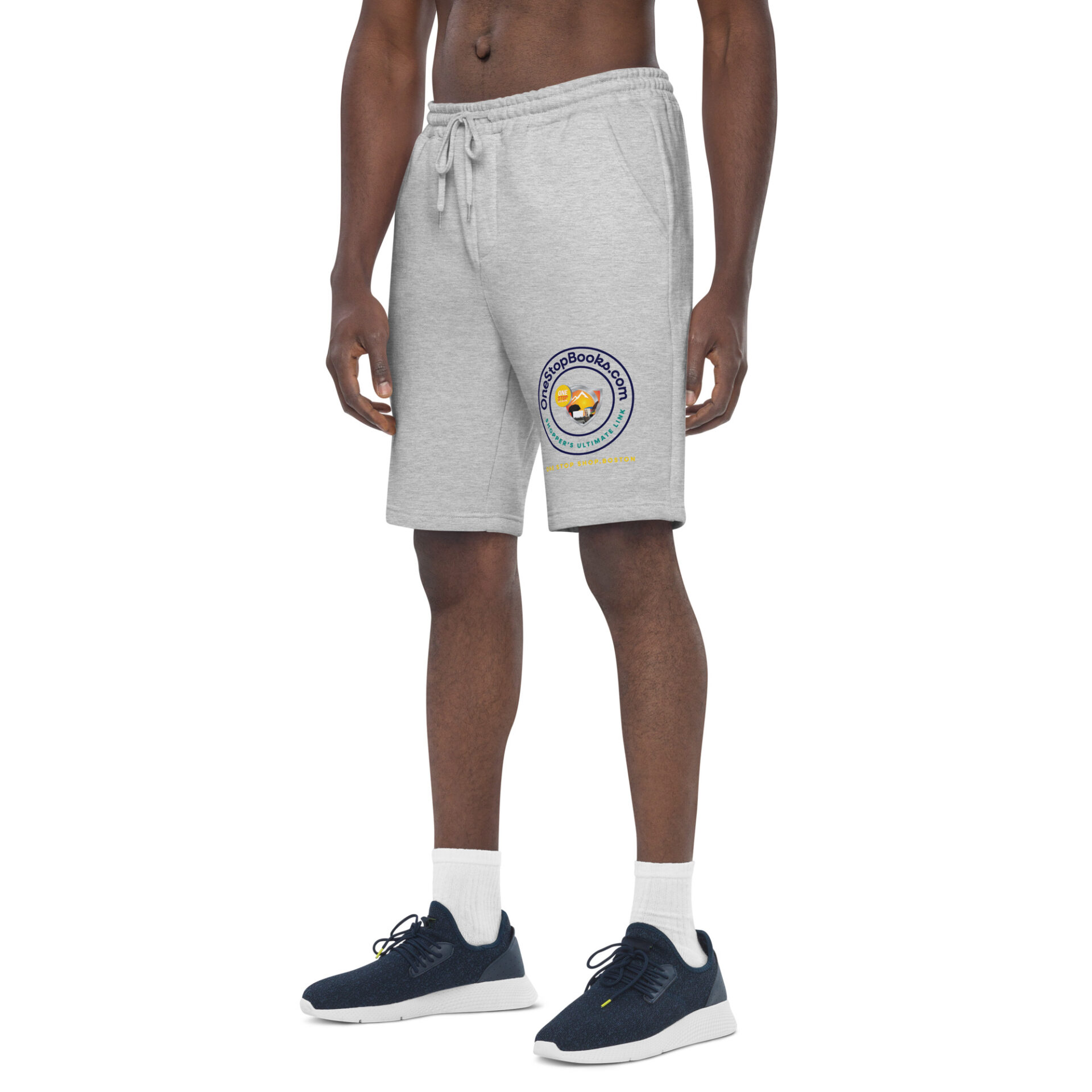 Man wearing grey shorts with logo.