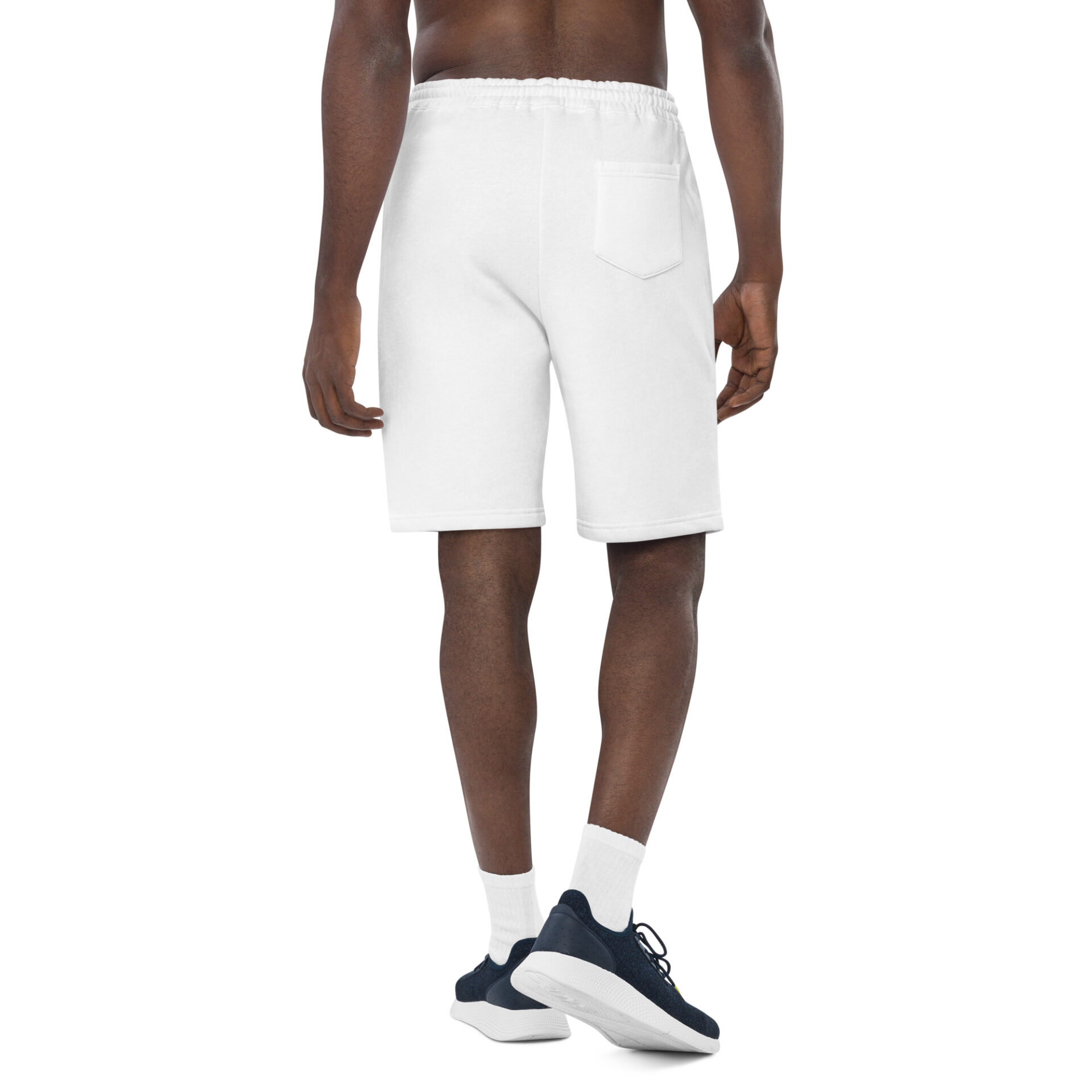 Man wearing white sweatpants and sneakers.