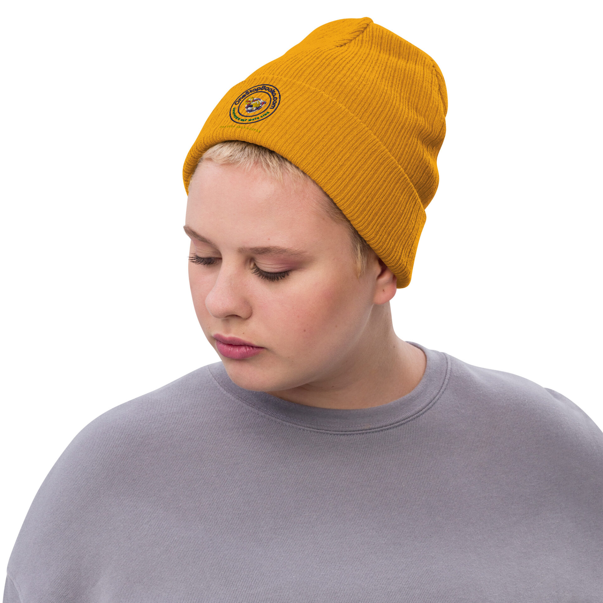 Person wearing a yellow beanie with logo.