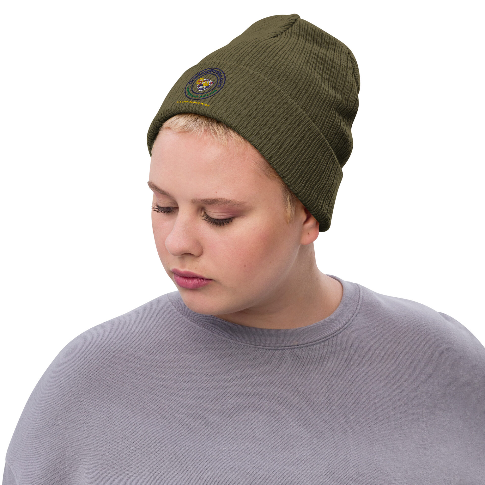 Person wearing green beanie with logo.