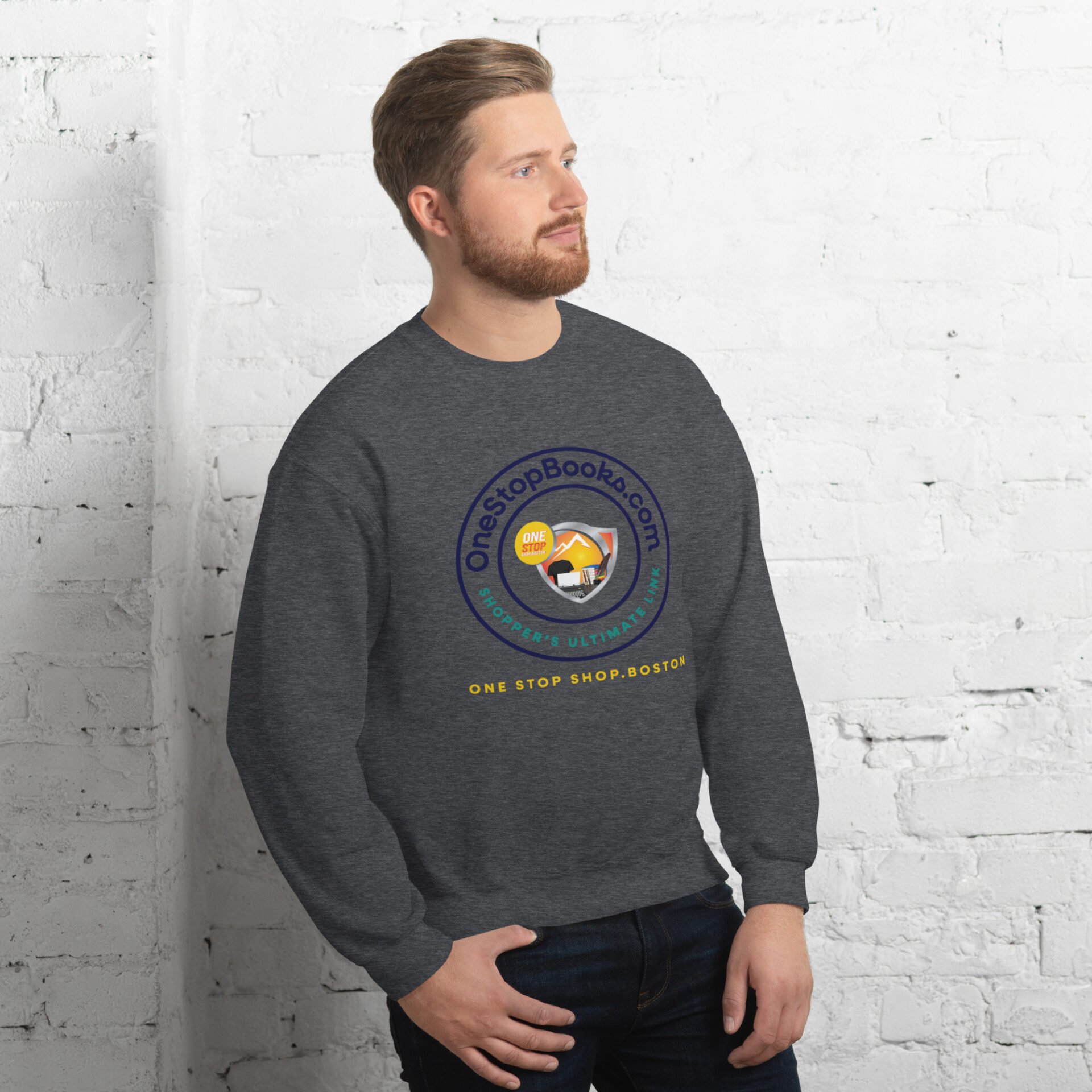Man wearing a grey sweatshirt with a logo.