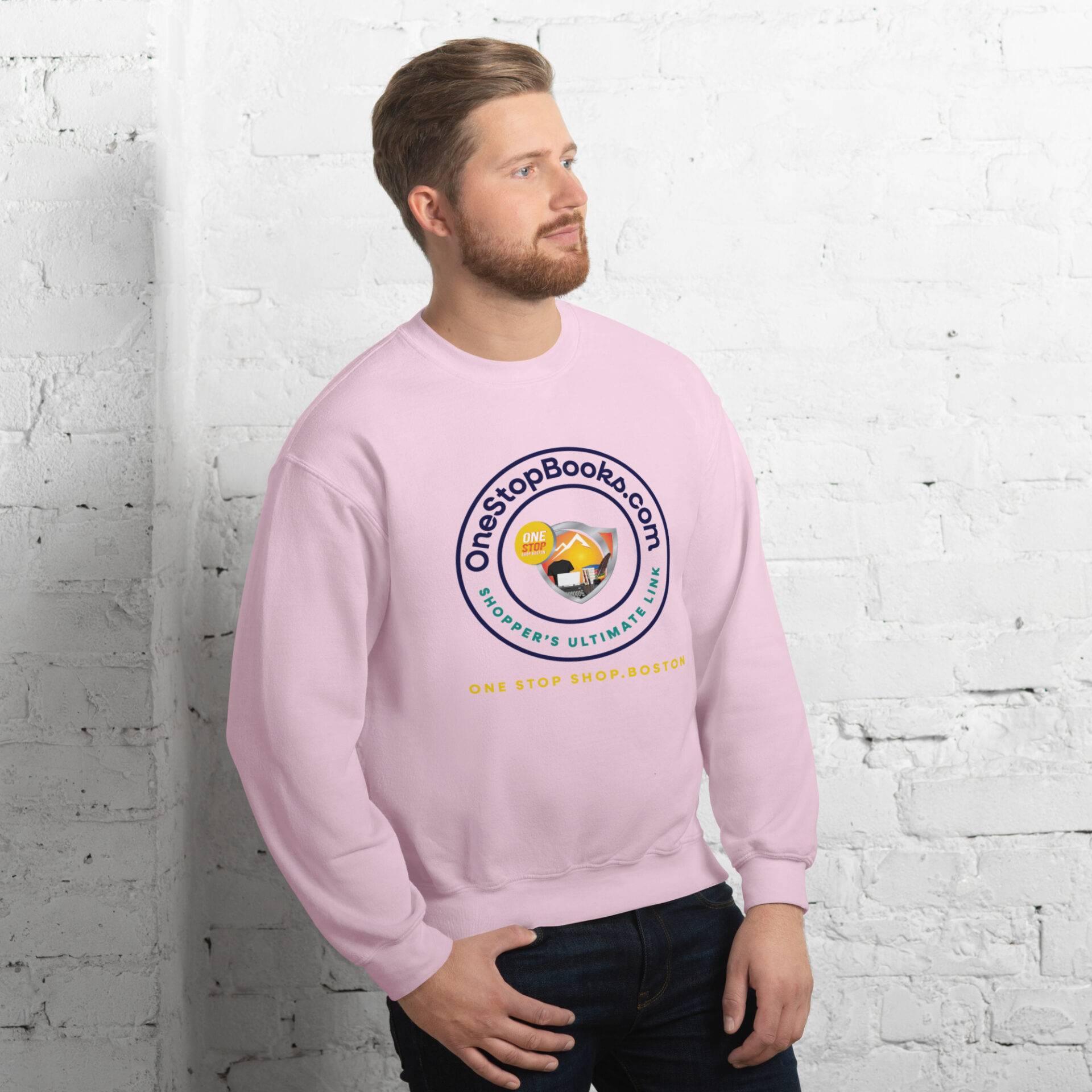 Man wearing pink sweatshirt with logo.