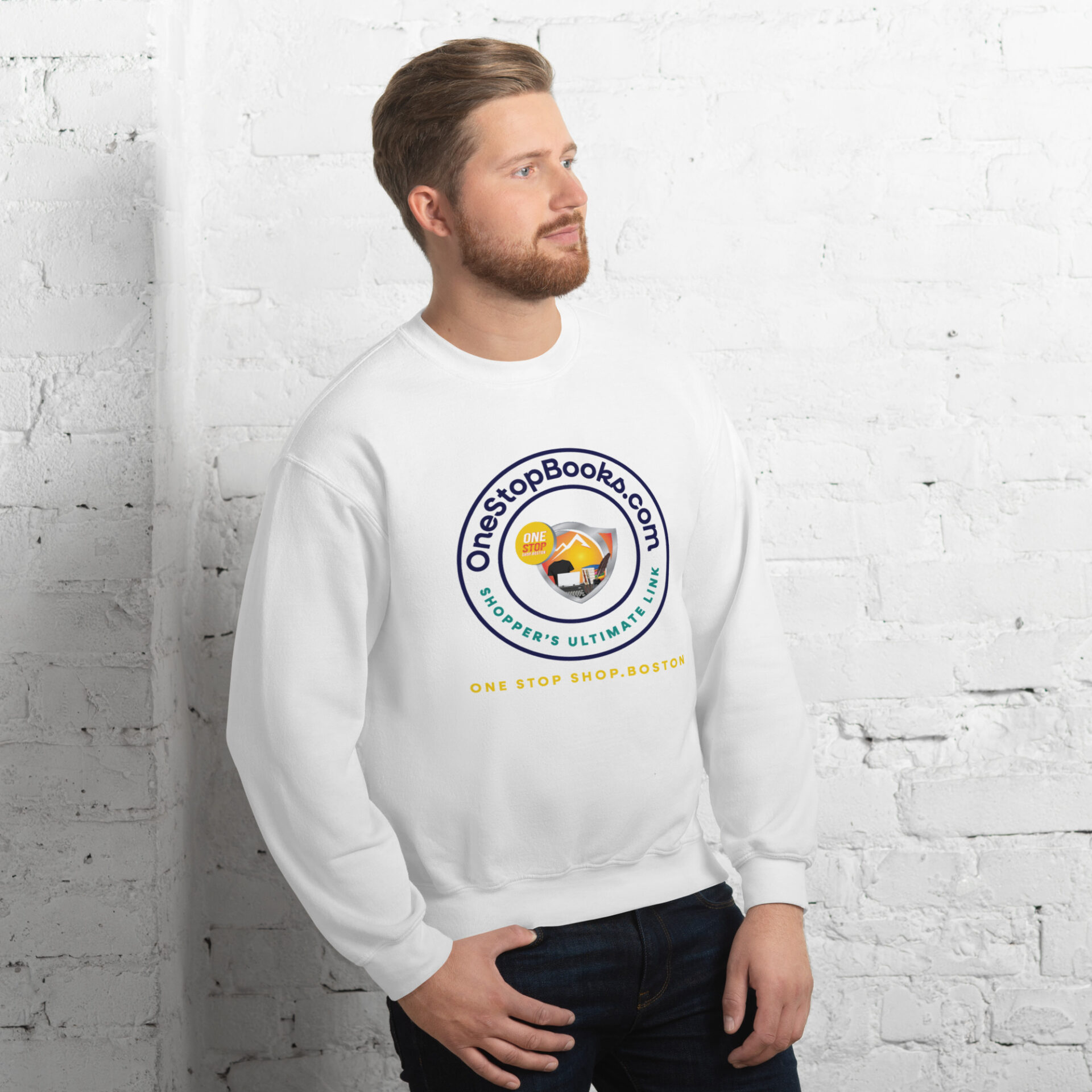 Man wearing a white sweatshirt with a logo.