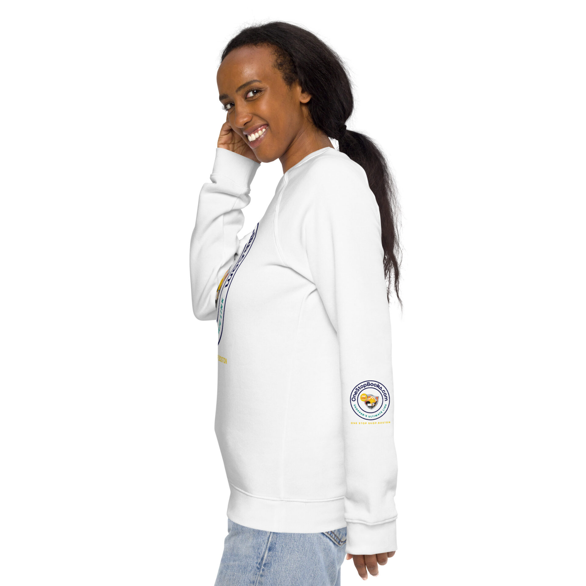 Woman wearing white sweatshirt with logo.