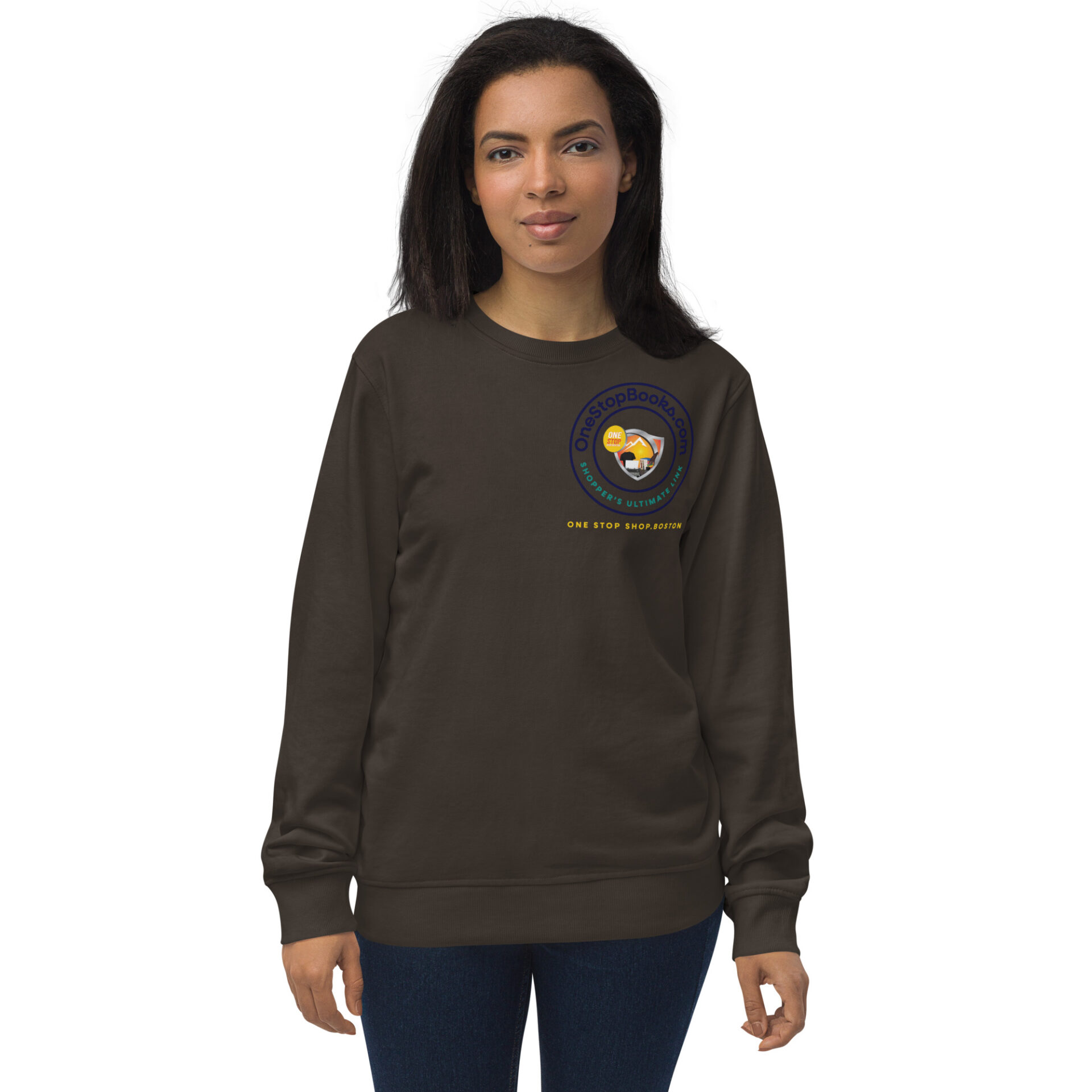 Woman wearing a brown sweatshirt with a logo.