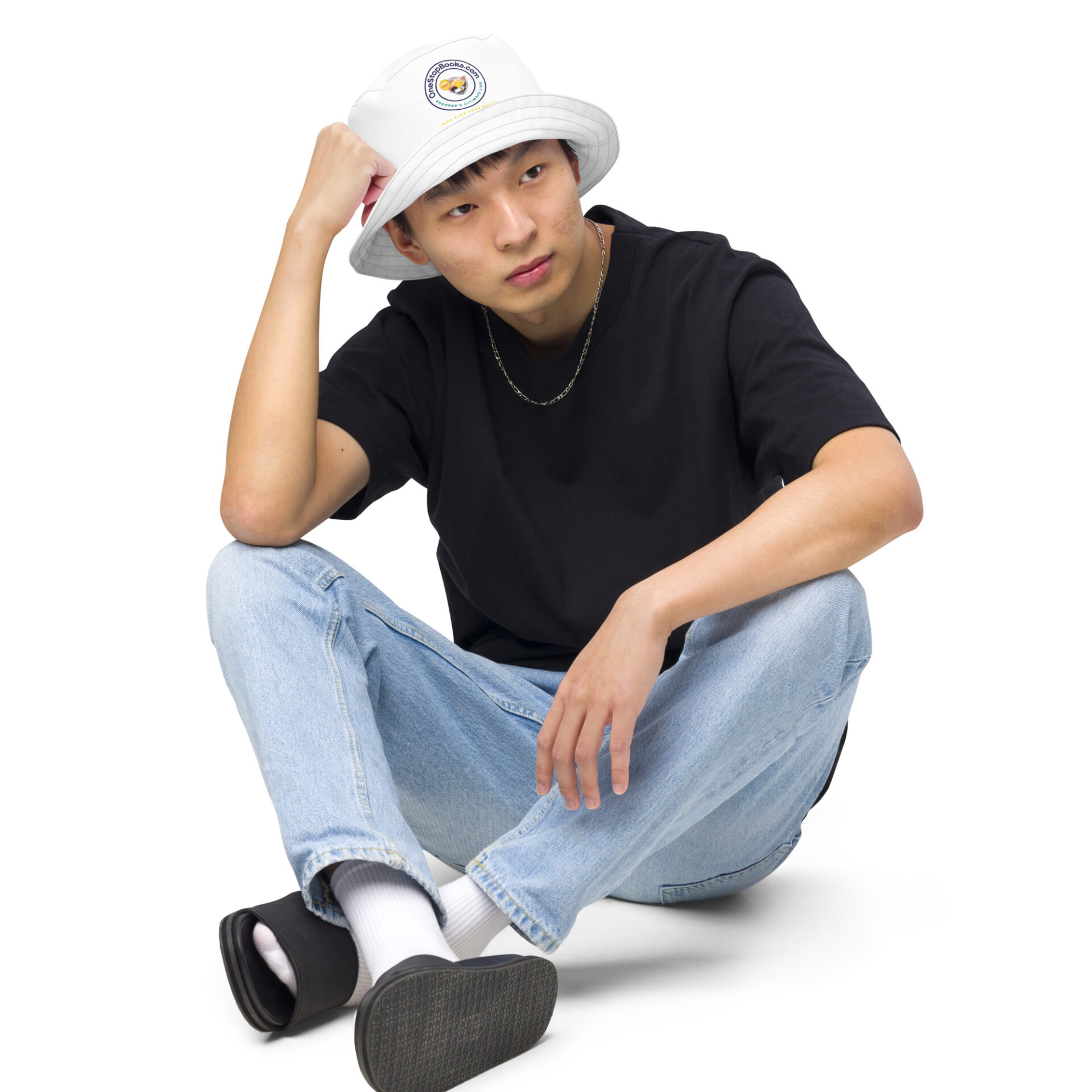 Man in jeans wearing a white bucket hat.