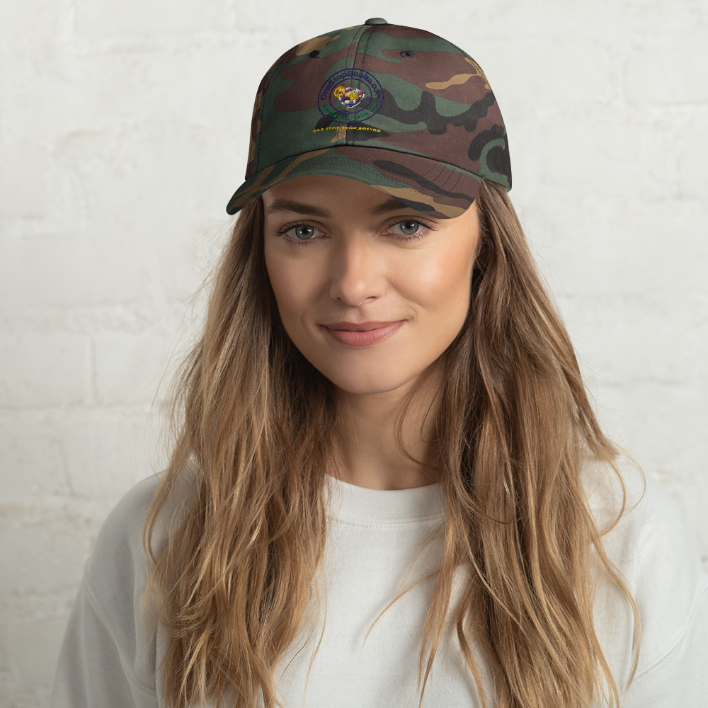 Woman wearing a camo baseball cap.