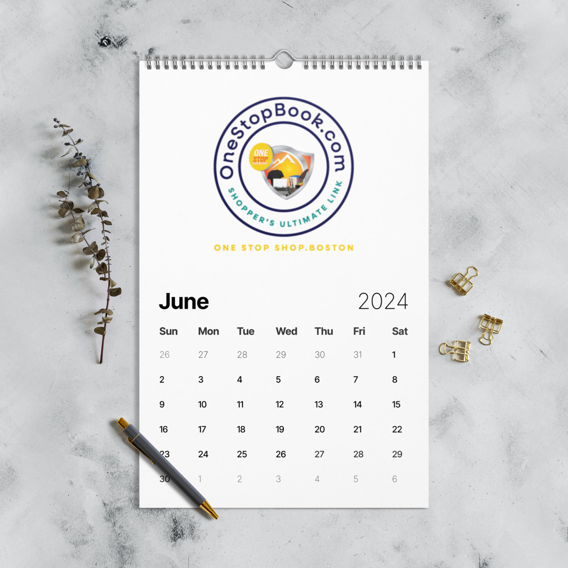 June 2024 calendar with gold clips.