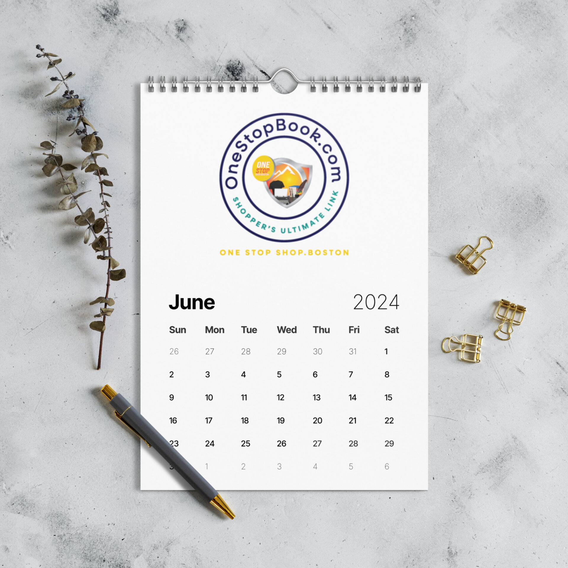 June 2024 calendar with pen and clips.